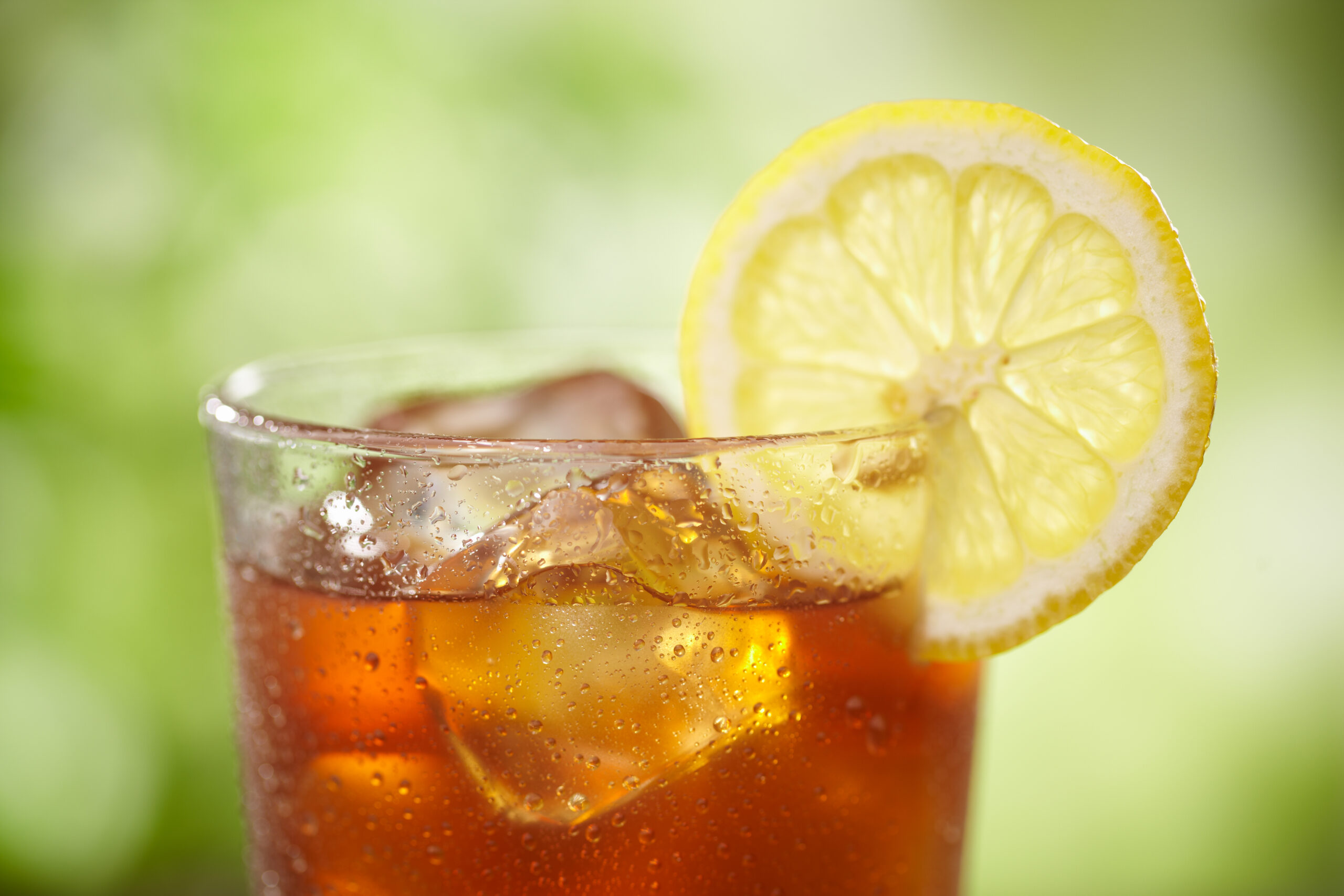 Tight shot of top of Iced tea in outdoor setting.