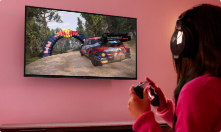 A woman playing video games on the Amazon Fire TV