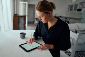 Woman drawing on tablet