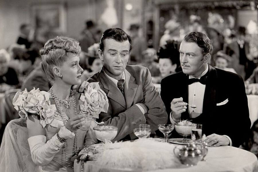 L. to R. : Martha Scott, John Wayne & Albert Dekker in In Old Oklahoma aka War of the Wildcats - cropped screenshot