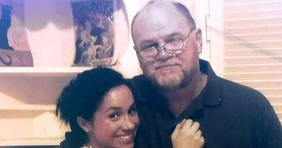 A young meghan markle hugging her dad