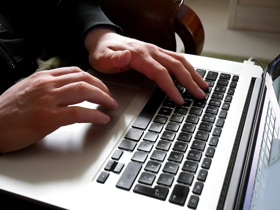 Hands and laptop